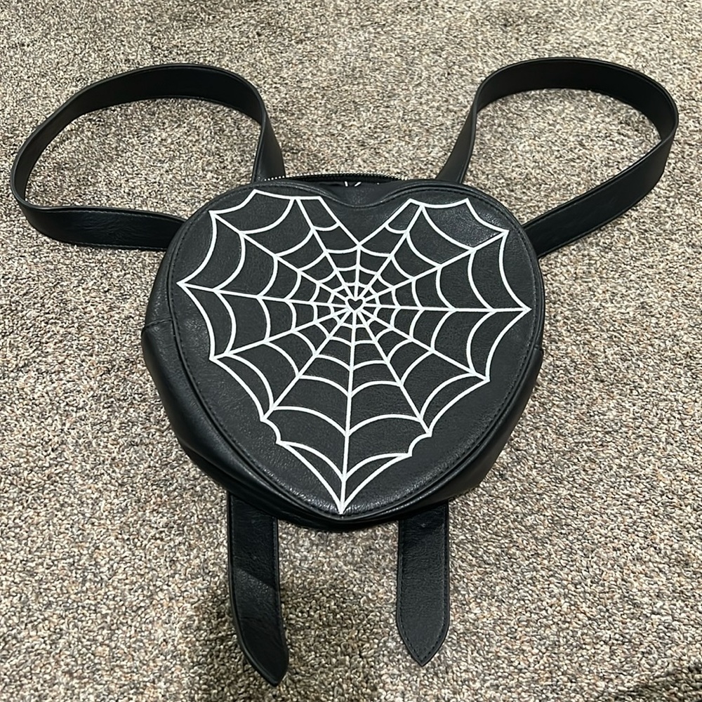 Heart shaped spider web backpack